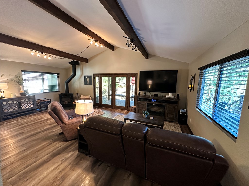 6615 Flag Mine Road Kingman, AZ 86401 - Photo 14 of 72 a living room with furniture and a flat screen tv