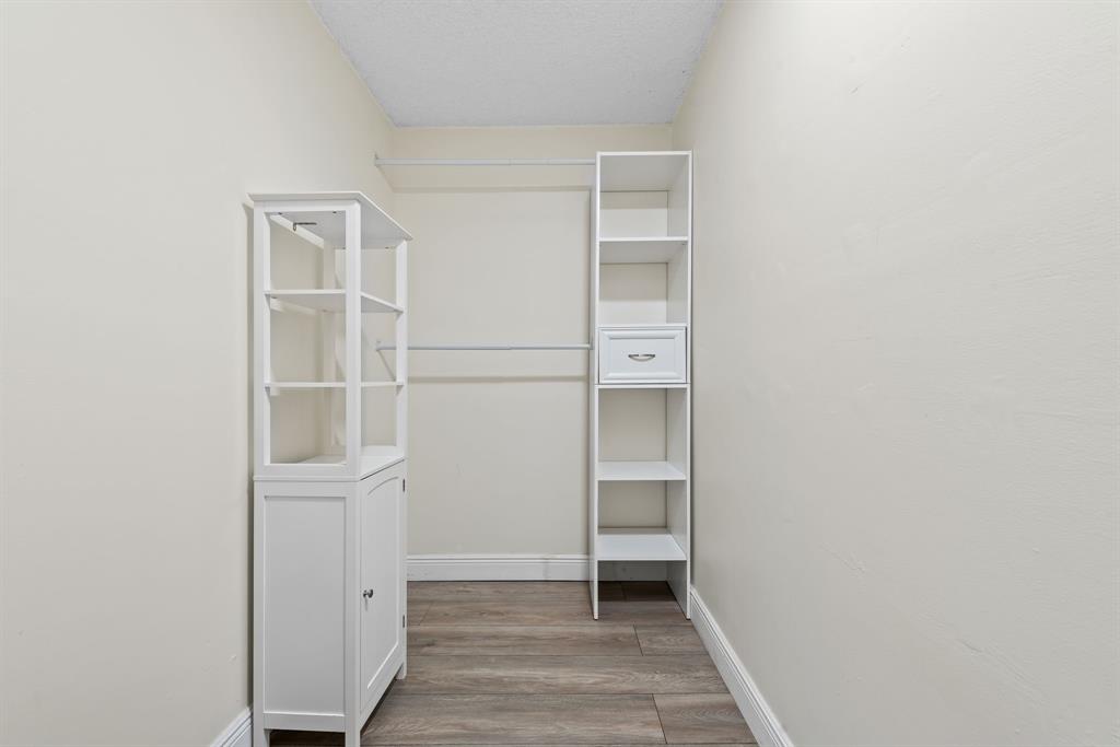 4902 Northwest 82nd Avenue, Unit 2001 Fort Lauderdale, FL 33351 - Photo 20 of 23 a view of walk in closet with empty racks