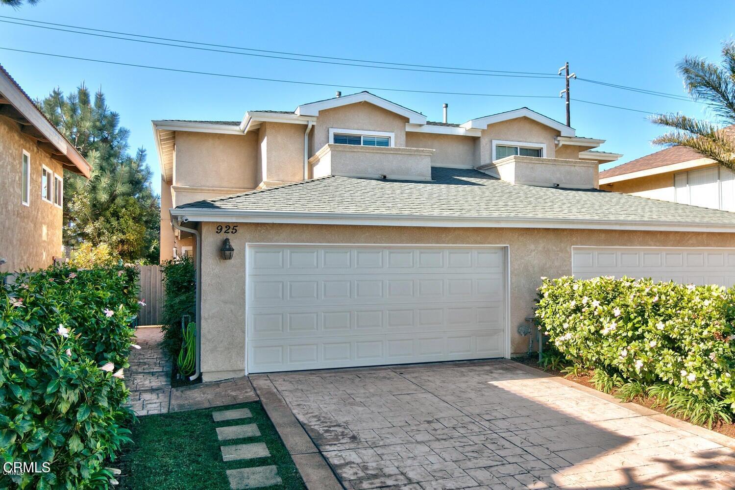 925 Dunes Street Oxnard, CA 93035 - Photo 1 of 27 a front view of a house with a garden