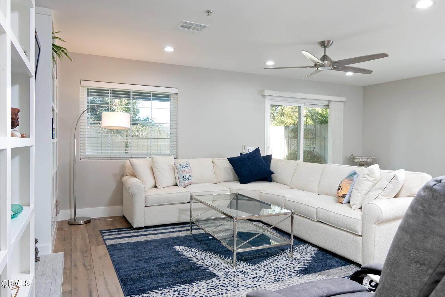 925 Dunes Street Oxnard, CA 93035 - Photo 11 of 27 a living room with furniture and a large window