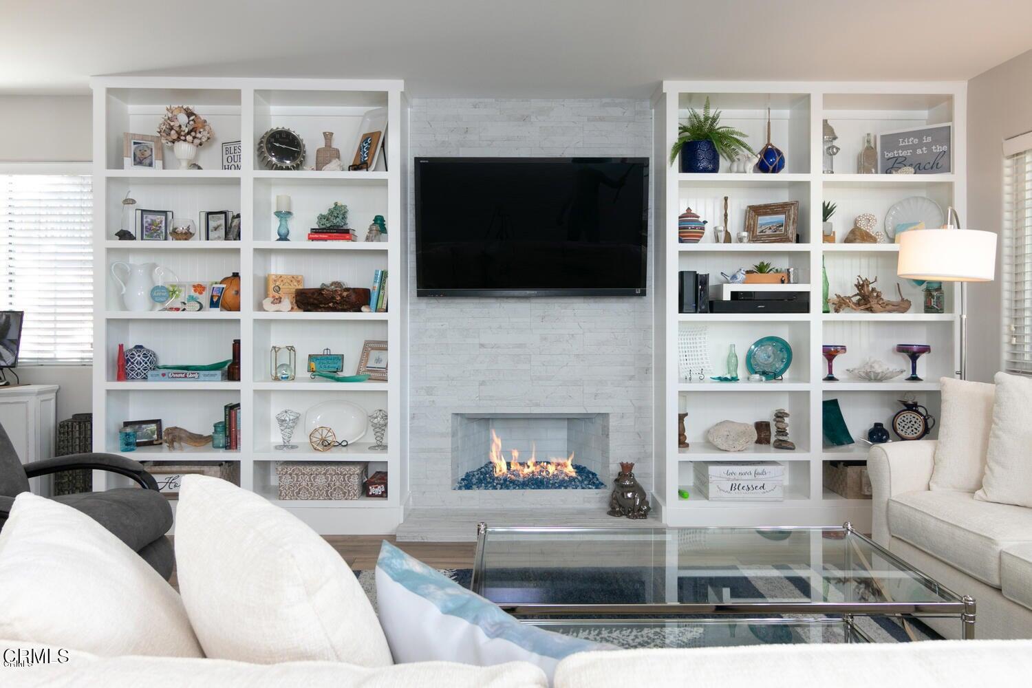 925 Dunes Street Oxnard, CA 93035 - Photo 12 of 27 a living room with furniture and a fireplace