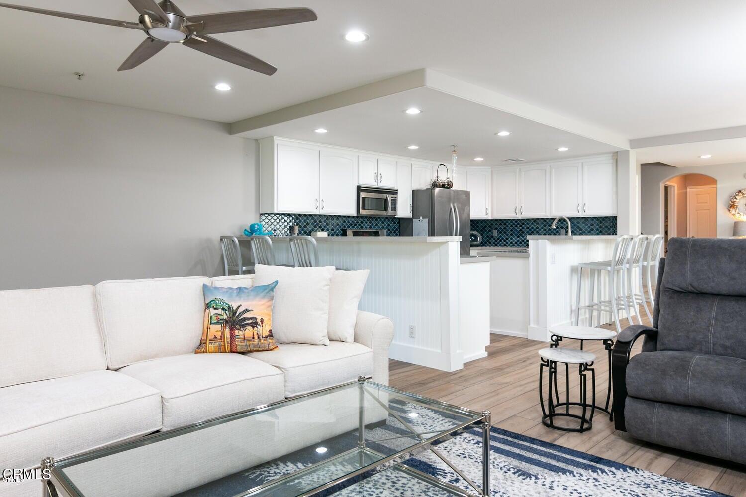 925 Dunes Street Oxnard, CA 93035 - Photo 15 of 27 a living room with furniture and kitchen view