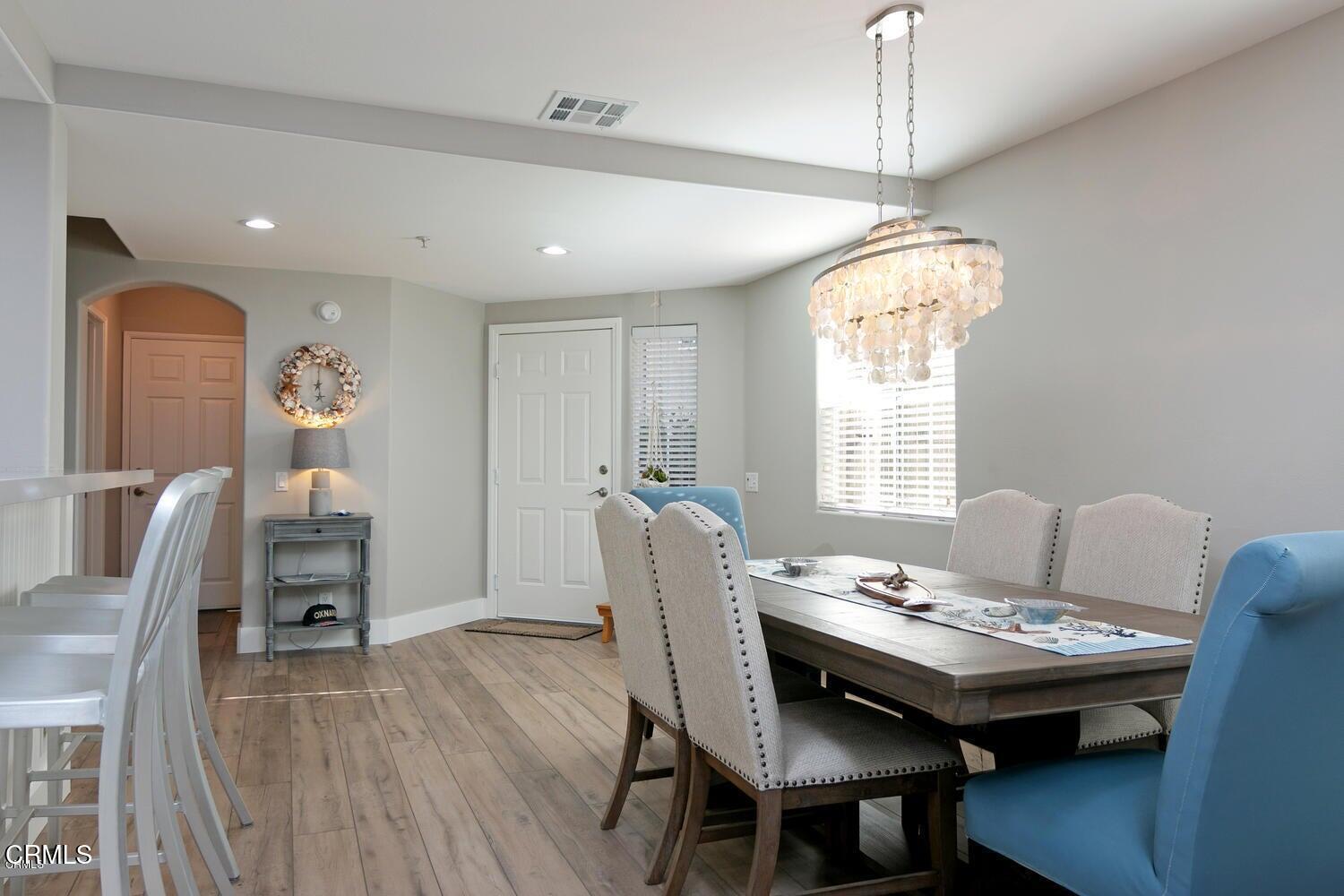925 Dunes Street Oxnard, CA 93035 - Photo 8 of 27 a view of a dining room with furniture window and wooden floor