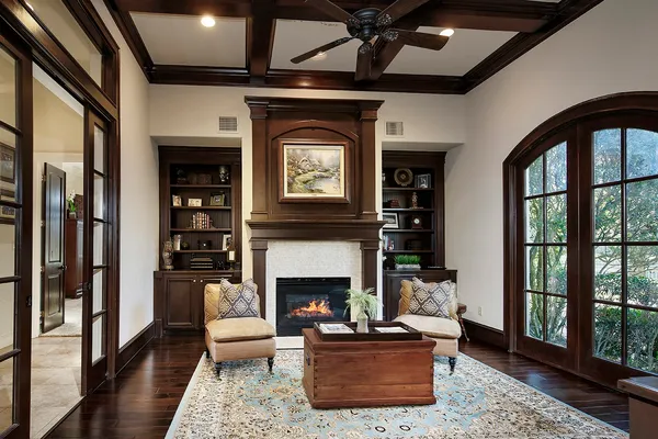 a living room with furniture a window and a fireplace