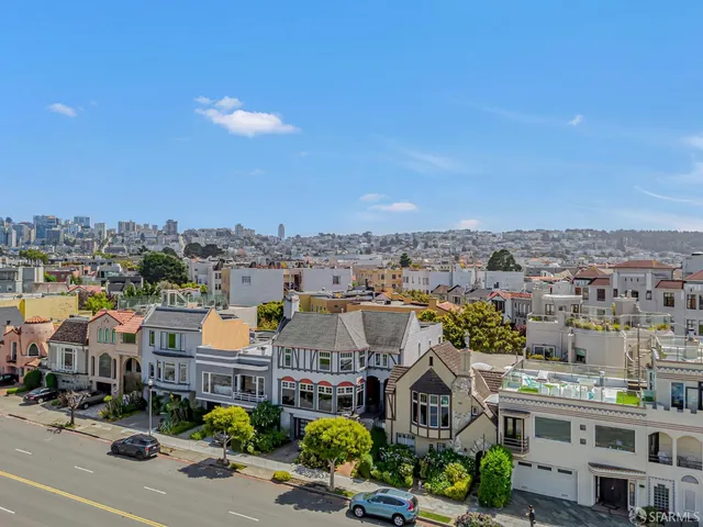 an aerial view of a house with a ocean view