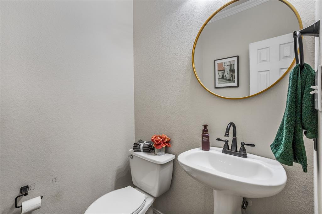3404 Belladonna Drive Plano, TX 75093 - Photo 12 of 24 a bathroom with a sink mirror and toilet