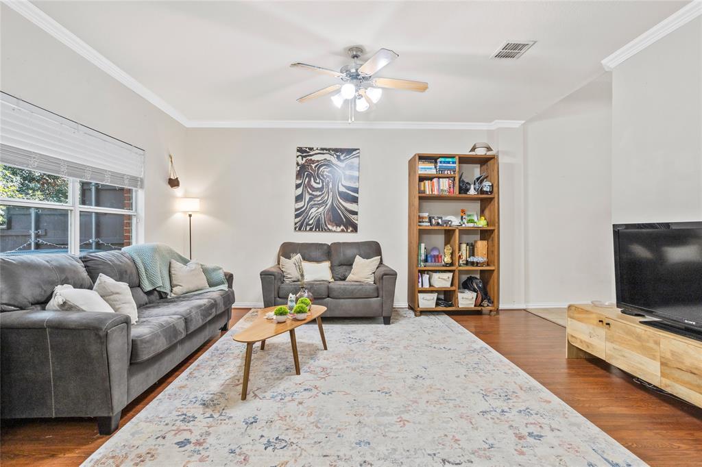 3404 Belladonna Drive Plano, TX 75093 - Photo 5 of 24 a living room with furniture and a flat screen tv