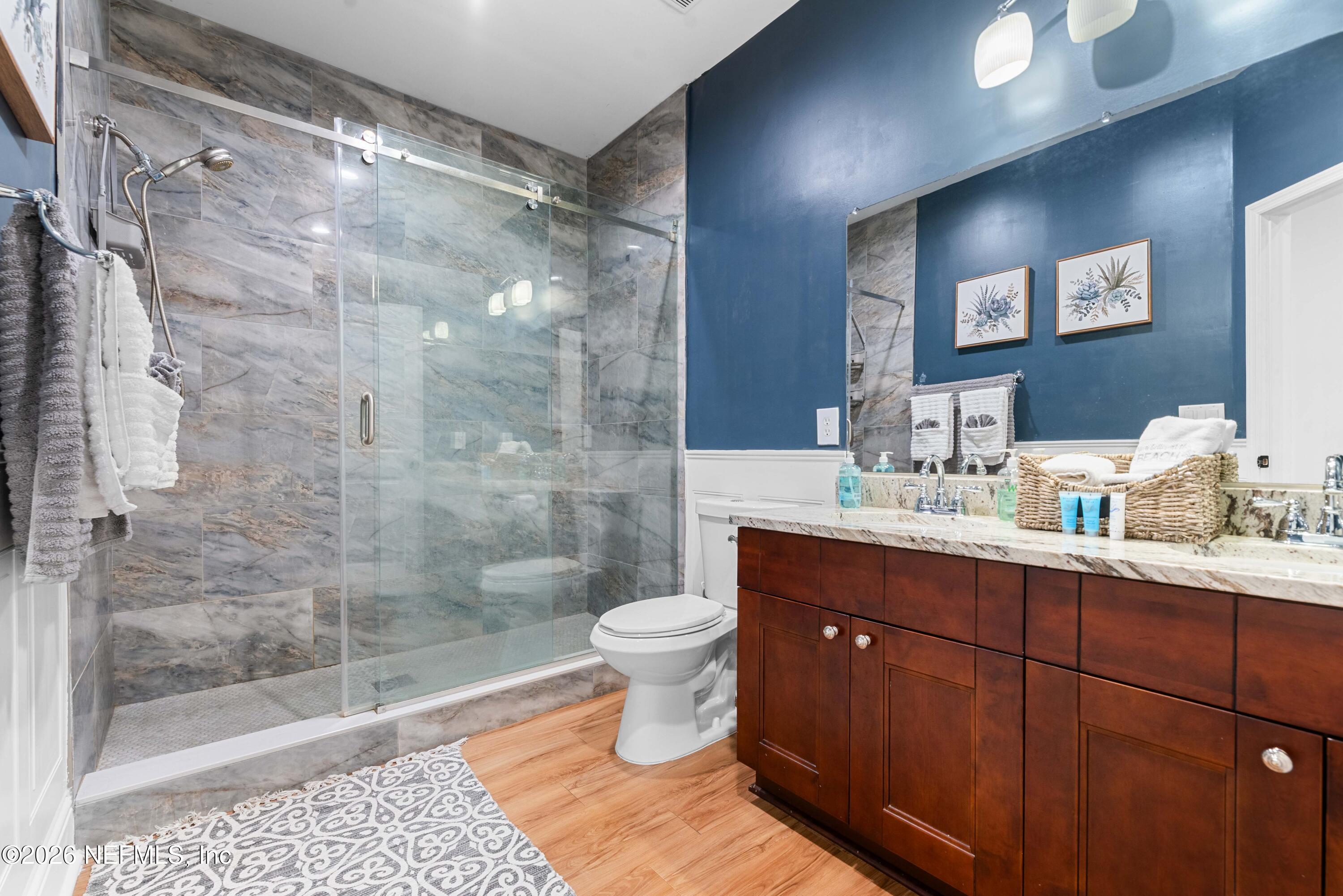 1138 Walnut Street Jacksonville, FL 32206 - Photo 35 of 37 a bathroom with a sink and a mirror