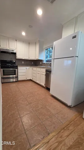 a bedroom with bed and a window