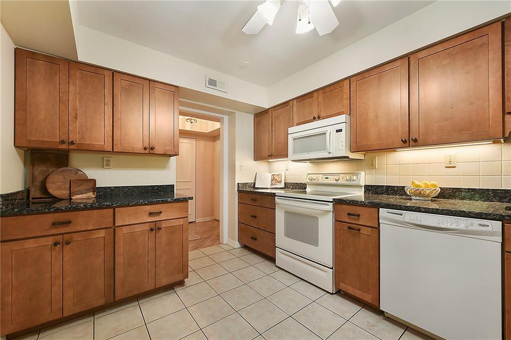 300 Fox Chapel Road, Unit 405 Pittsburgh, PA 15238 - Photo 14 of 30 a kitchen with granite countertop cabinets and stainless steel appliances