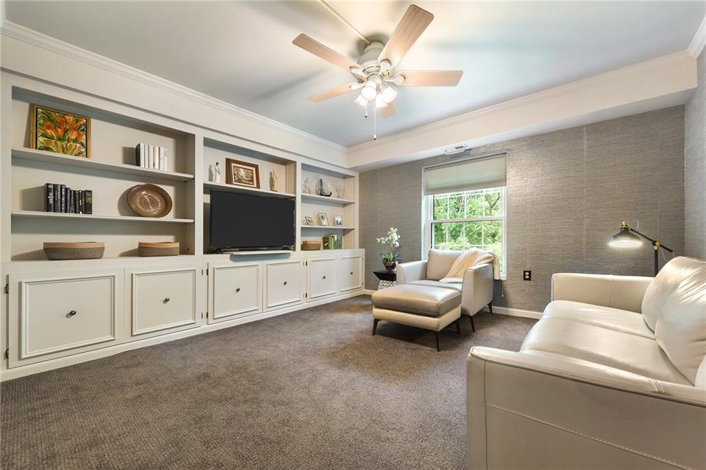 300 Fox Chapel Road, Unit 405 Pittsburgh, PA 15238 - Photo 17 of 30 a living room with furniture and a flat screen tv