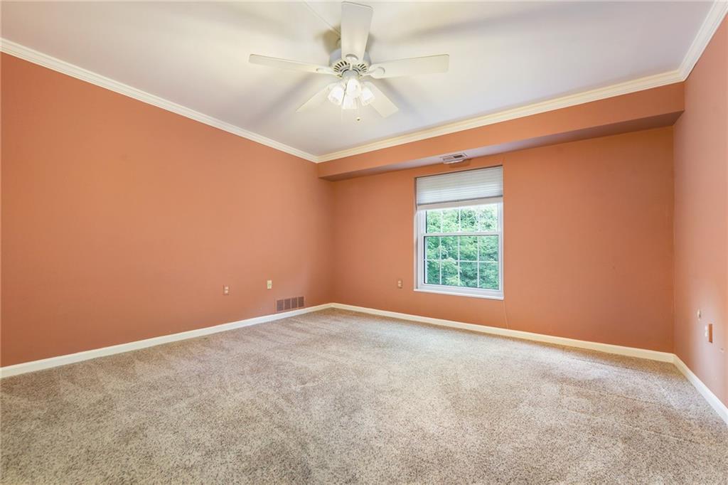 300 Fox Chapel Road, Unit 405 Pittsburgh, PA 15238 - Photo 23 of 30 an empty room with windows and fan