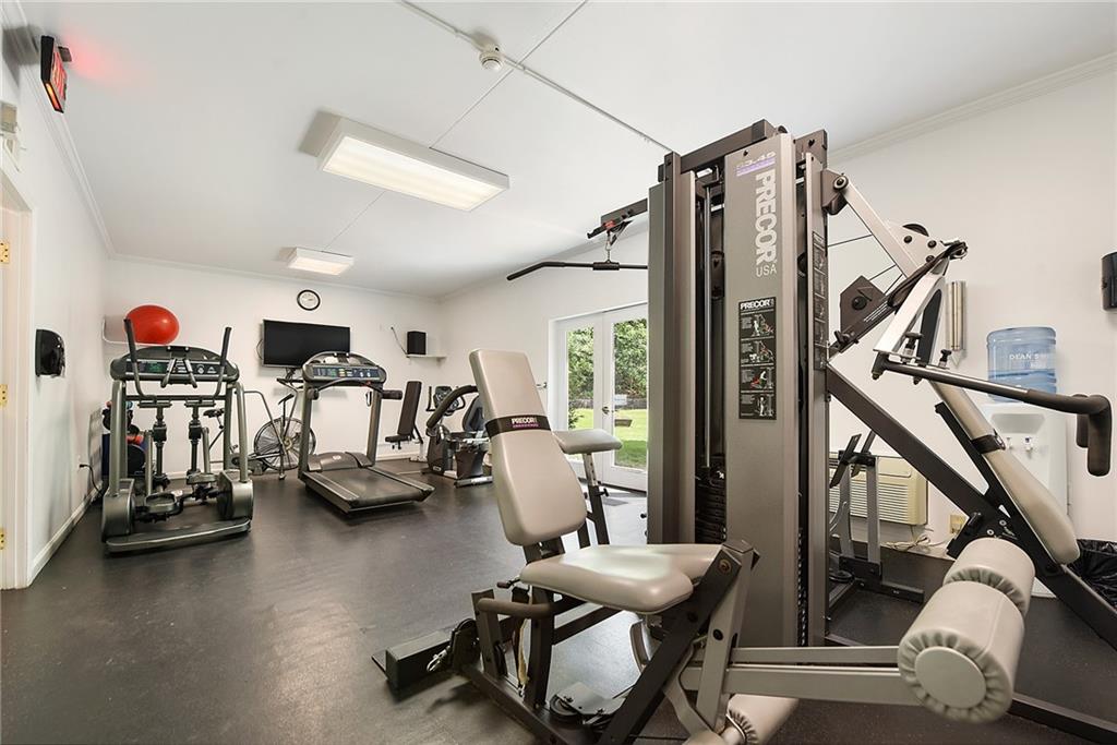 300 Fox Chapel Road, Unit 405 Pittsburgh, PA 15238 - Photo 28 of 30 a living room with lots of furniture and gym equipment