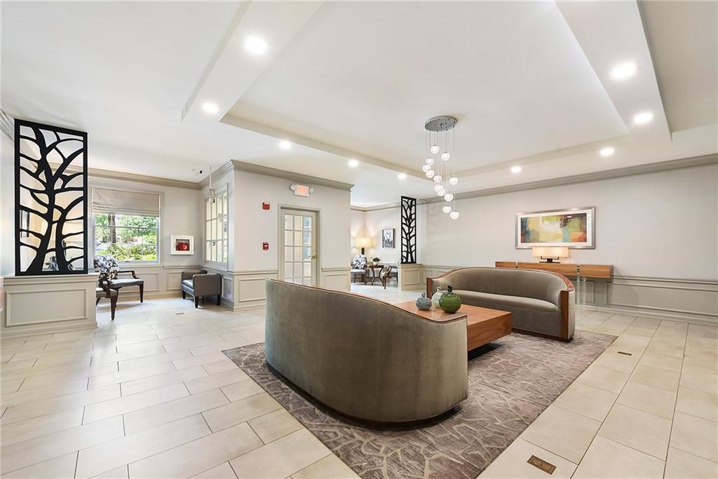 300 Fox Chapel Road, Unit 405 Pittsburgh, PA 15238 - Photo 3 of 30 a living room with furniture and a large window