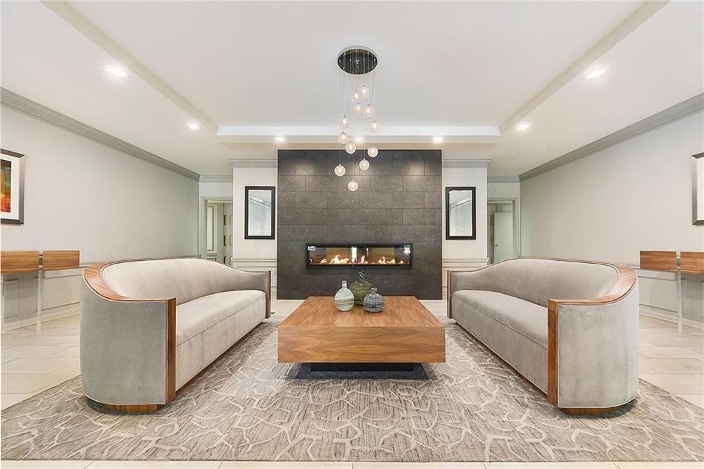 300 Fox Chapel Road, Unit 405 Pittsburgh, PA 15238 - Photo 4 of 30 a spacious bedroom with a bed and a couch