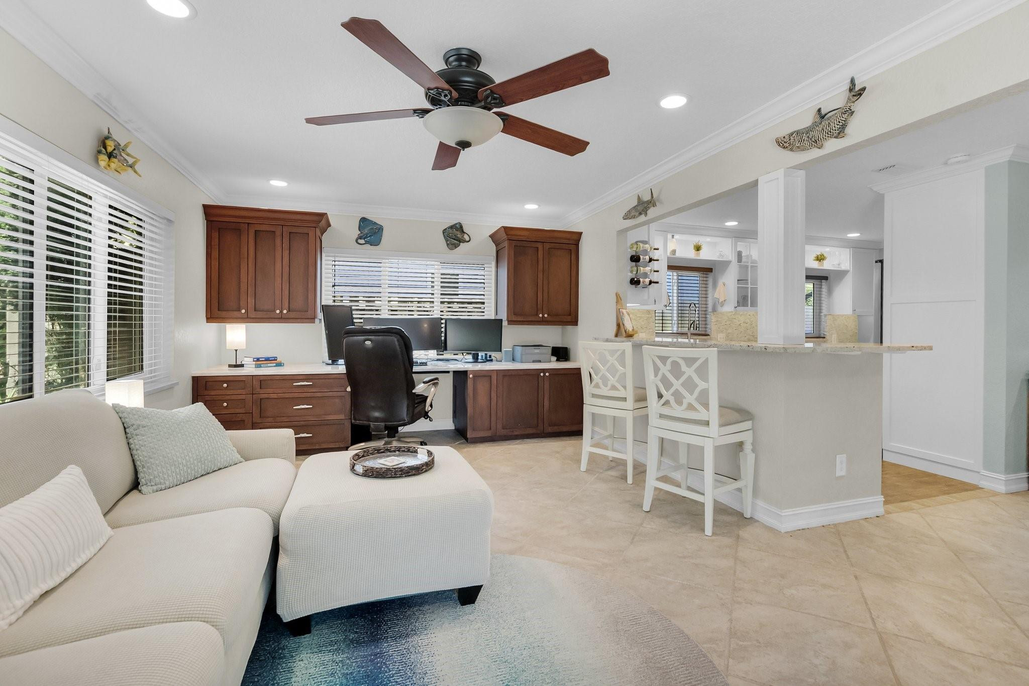548 Northwest 55th Street Boca Raton, FL 33487 - Photo 12 of 33 a living room with furniture a ceiling fan and a window