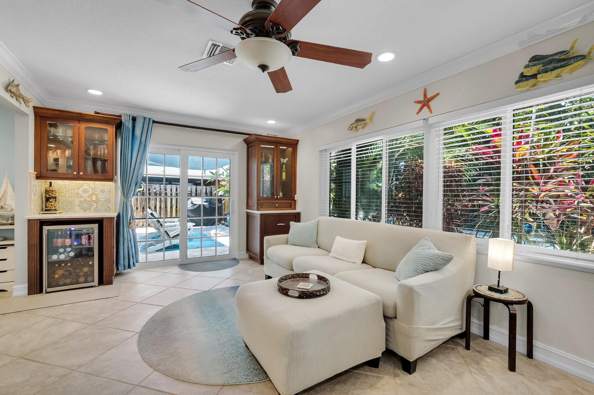 548 Northwest 55th Street Boca Raton, FL 33487 - Photo 13 of 33 a living room with furniture and a fireplace