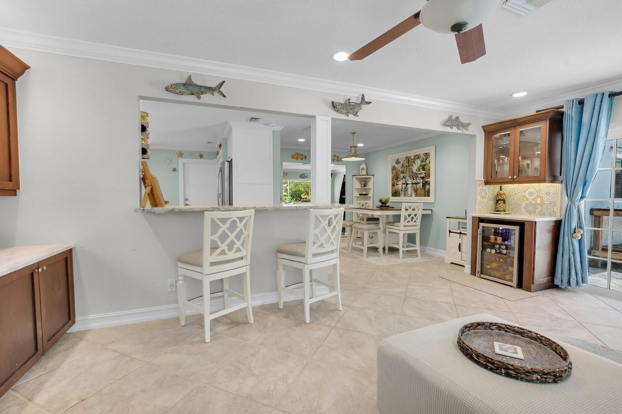 548 Northwest 55th Street Boca Raton, FL 33487 - Photo 14 of 33 a living room with furniture and a fireplace