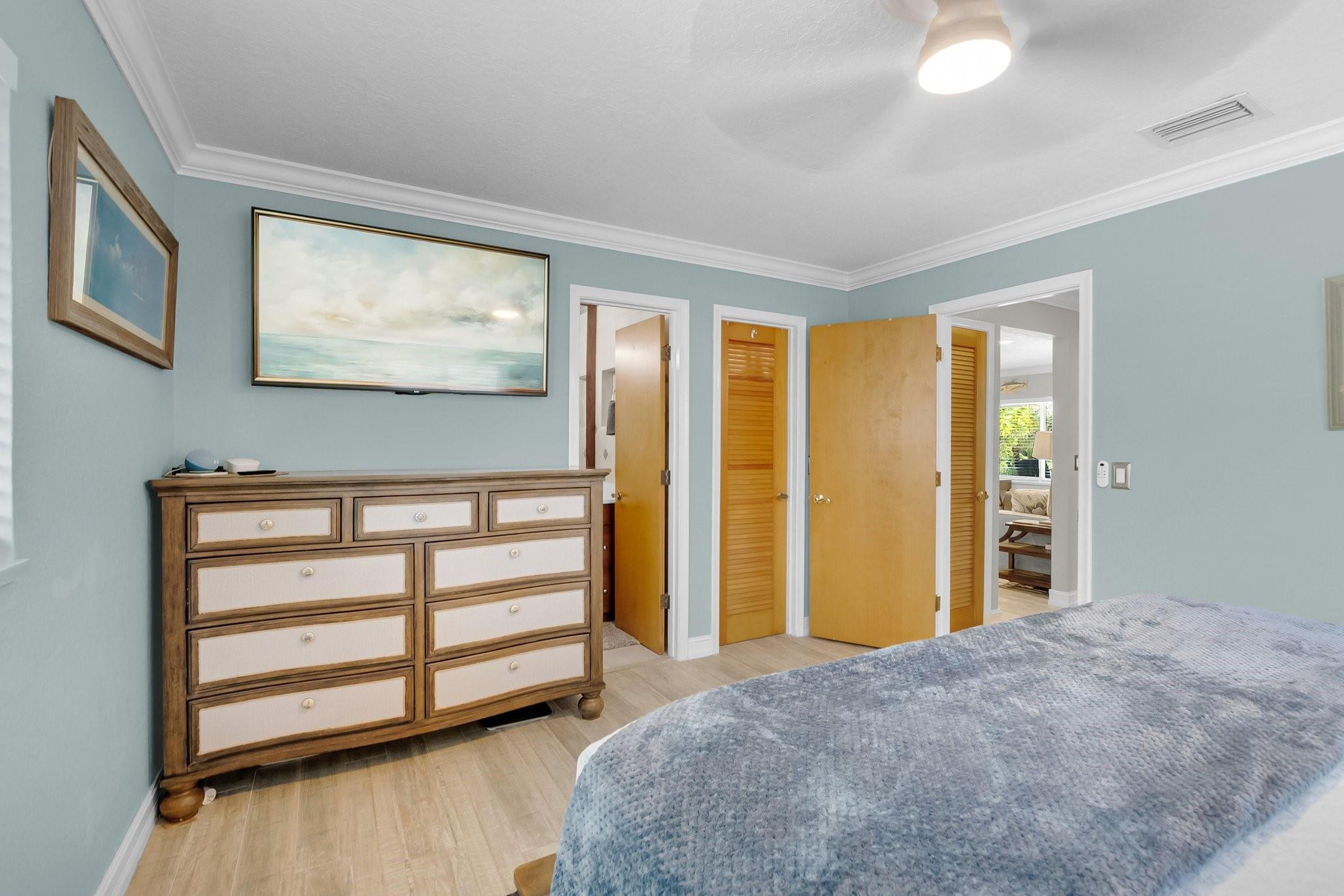 548 Northwest 55th Street Boca Raton, FL 33487 - Photo 19 of 33 a bedroom with a bed and wooden floor