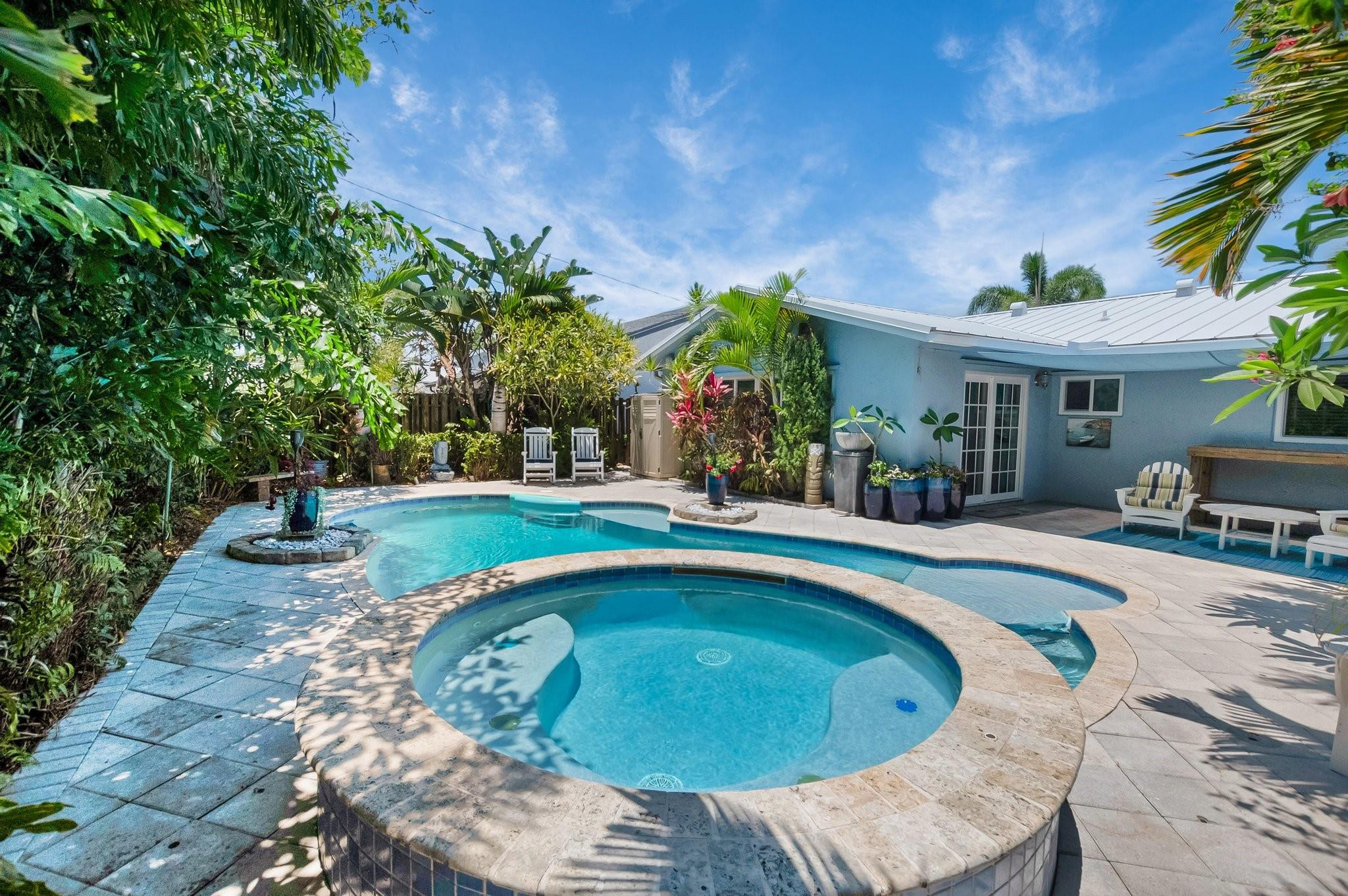 548 Northwest 55th Street Boca Raton, FL 33487 - Photo 30 of 33 a swimming pool with outdoor seating and yard