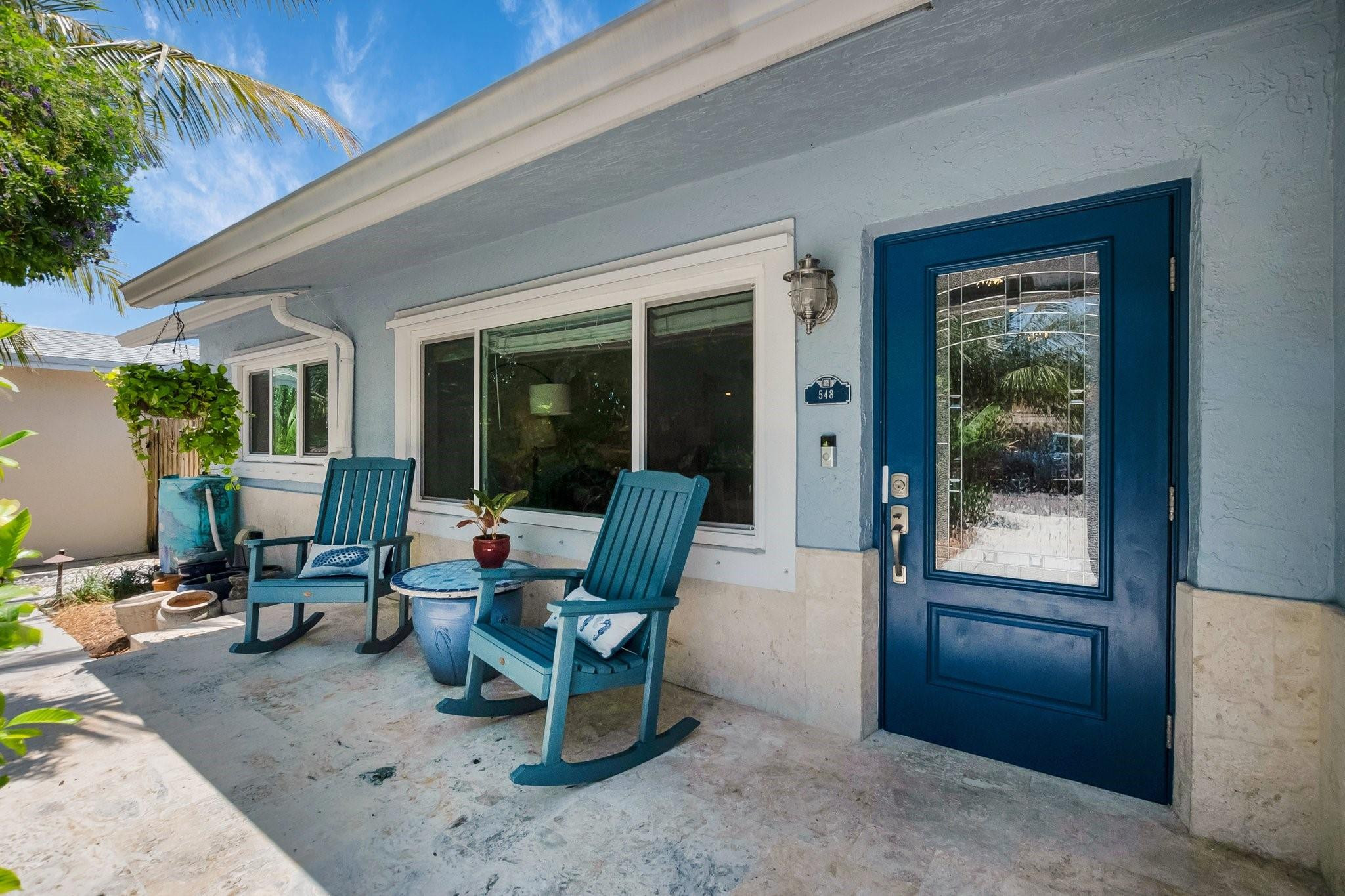 548 Northwest 55th Street Boca Raton, FL 33487 - Photo 3 of 33 a living room with furniture and a window
