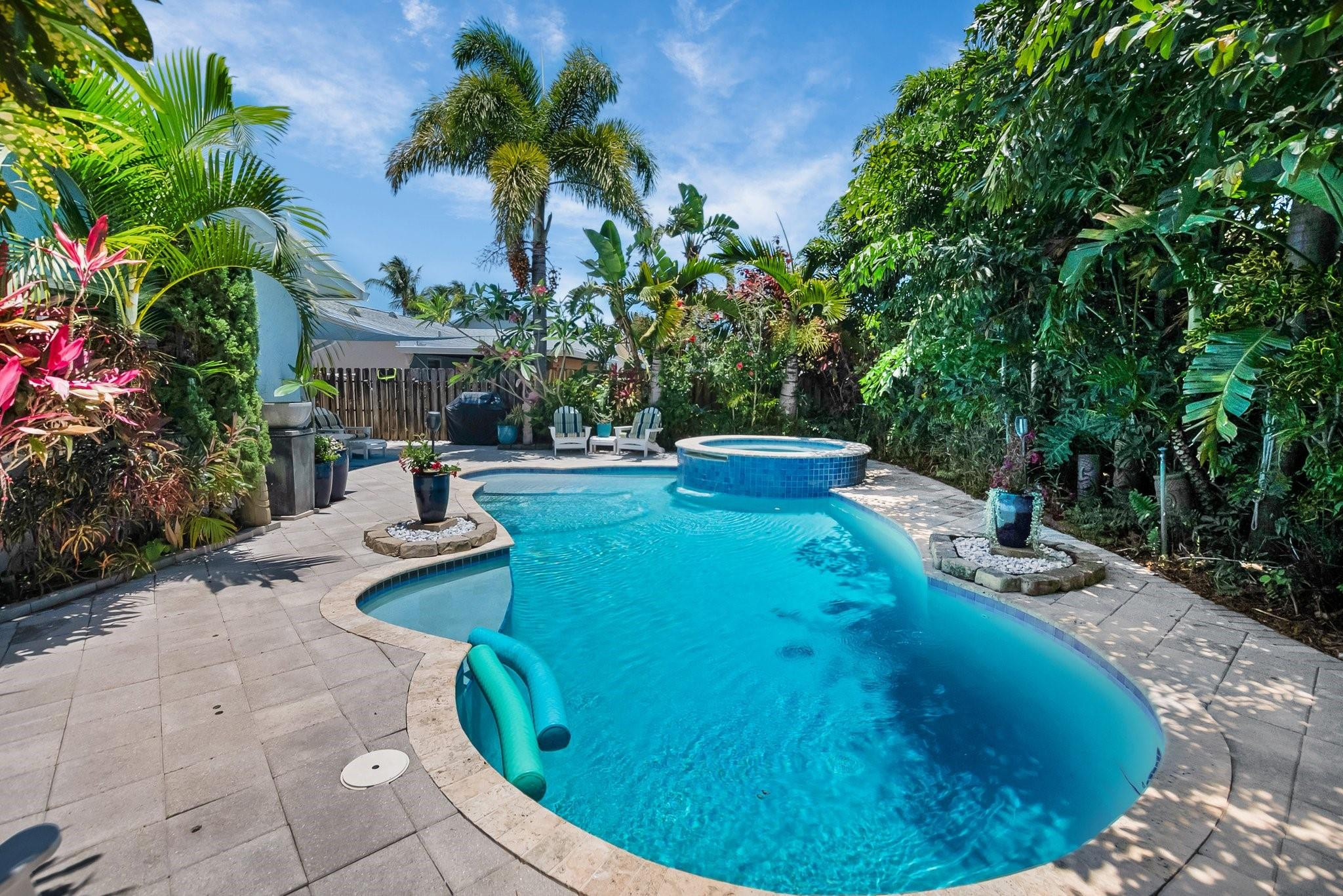 548 Northwest 55th Street Boca Raton, FL 33487 - Photo 31 of 33 a view of a swimming pool with sitting area
