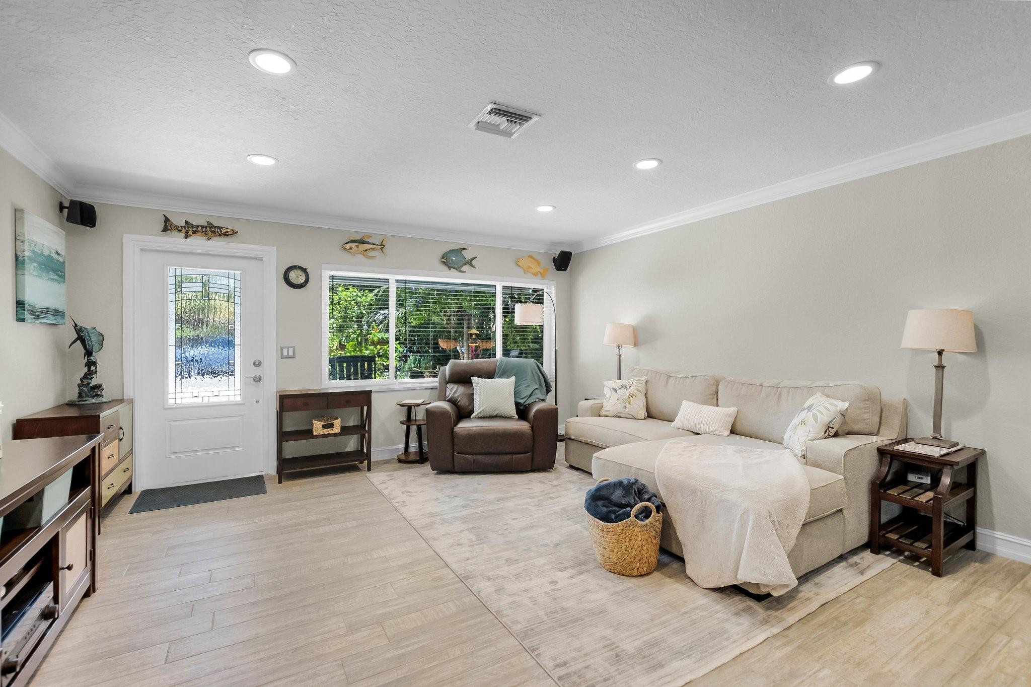 548 Northwest 55th Street Boca Raton, FL 33487 - Photo 4 of 33 a living room with furniture and a large window