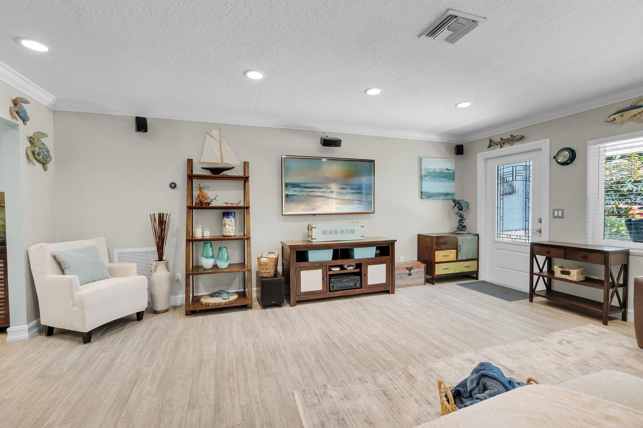 548 Northwest 55th Street Boca Raton, FL 33487 - Photo 5 of 33 a living room with furniture and a couch