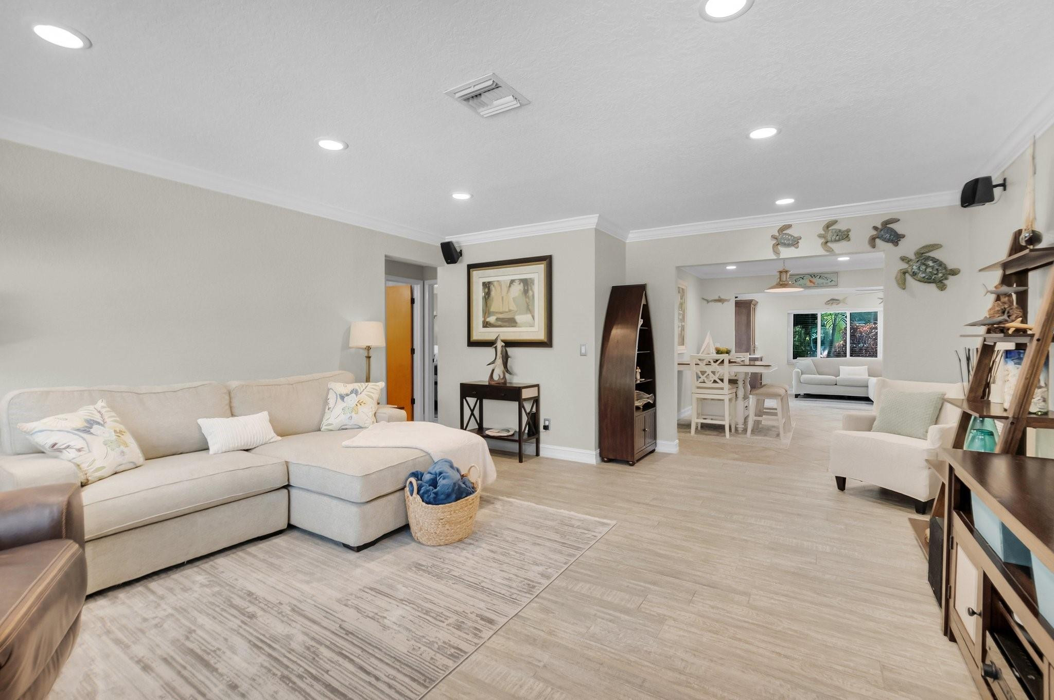 548 Northwest 55th Street Boca Raton, FL 33487 - Photo 6 of 33 a living room with furniture and flat screen tv