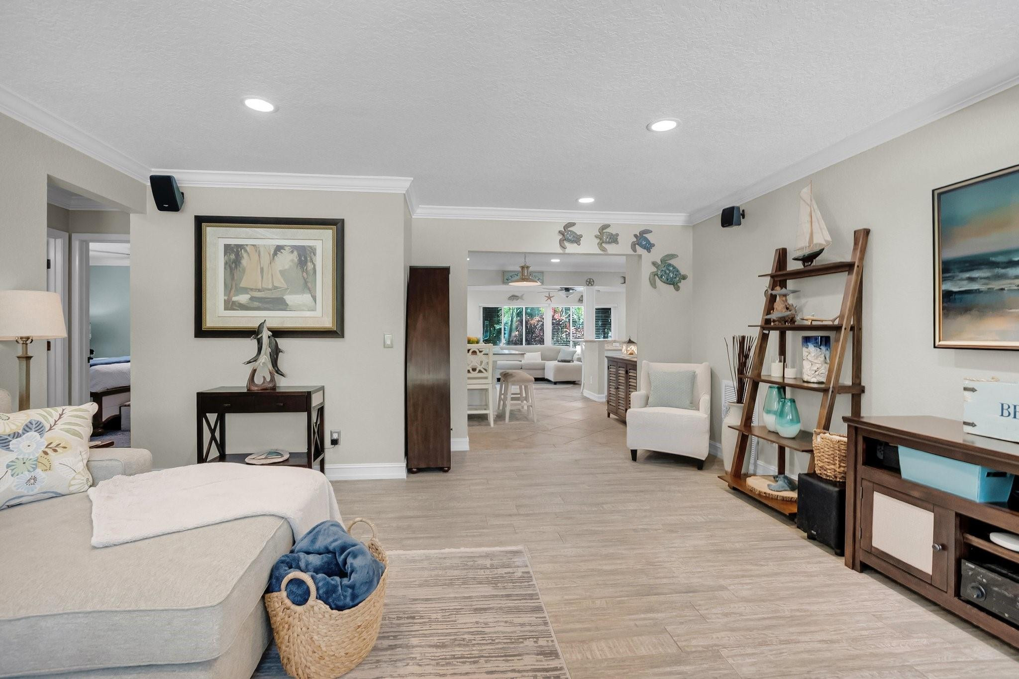548 Northwest 55th Street Boca Raton, FL 33487 - Photo 7 of 33 a living room with furniture and a flat screen tv