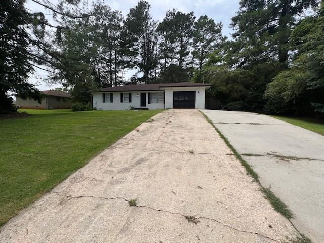 6935 Fielder Road Rex, GA 30273 - Photo 2 of 22 a front view of a house with a garden
