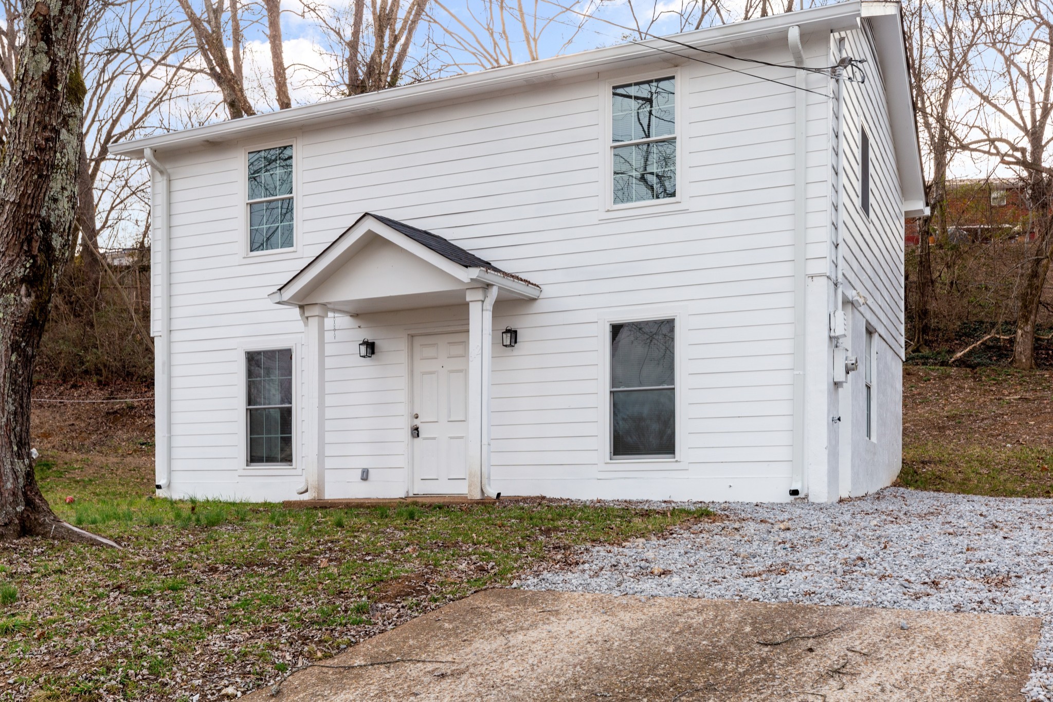 a view of a house with a yard