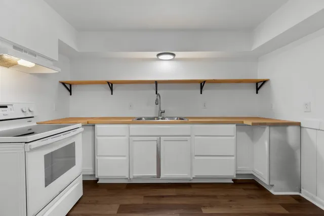 a view of cabinets and wooden floor