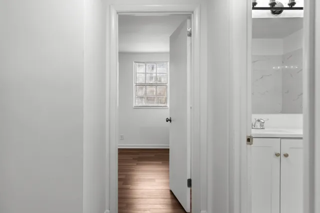 a view of a bathroom from the hallway