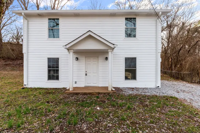 a front view of house with yard