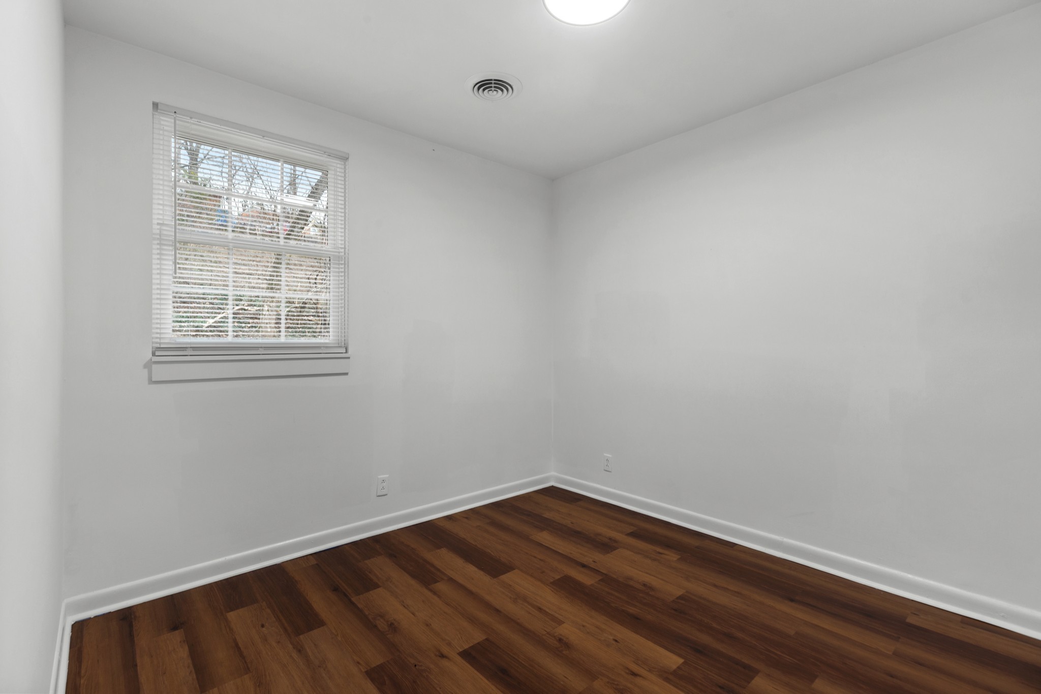 612 Andrea Court Antioch, TN 37013 - Photo 22 of 28 a view of an empty room with wooden floor and a window