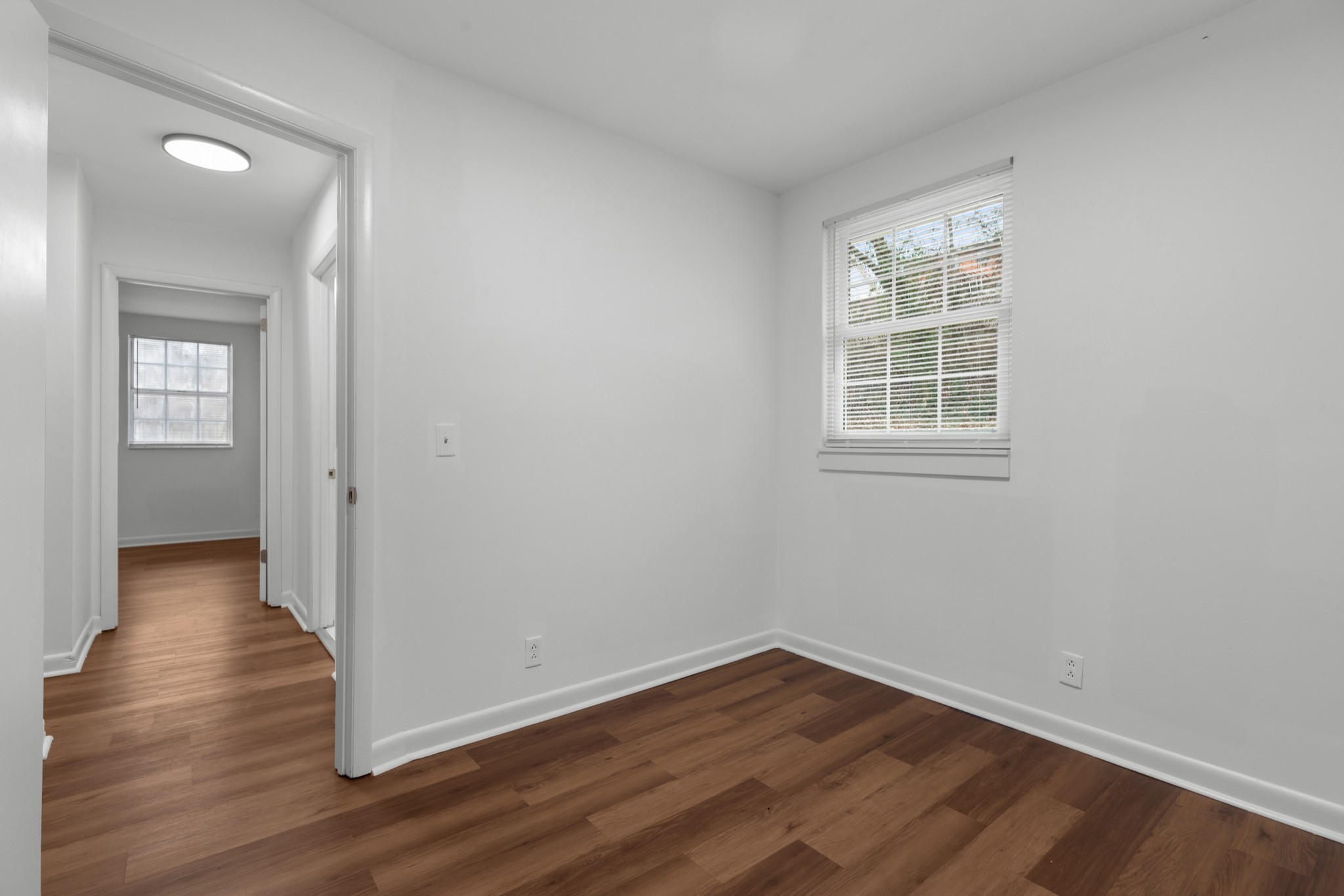 612 Andrea Court Antioch, TN 37013 - Photo 24 of 28 an empty room with wooden floor and windows