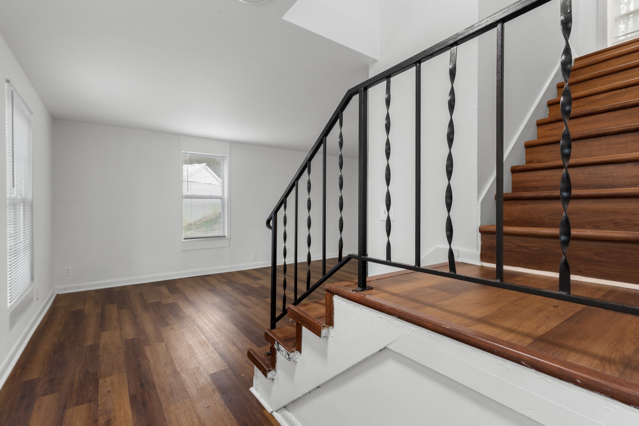 612 Andrea Court Antioch, TN 37013 - Photo 4 of 28 a view of a hallway with wooden floor and staircase