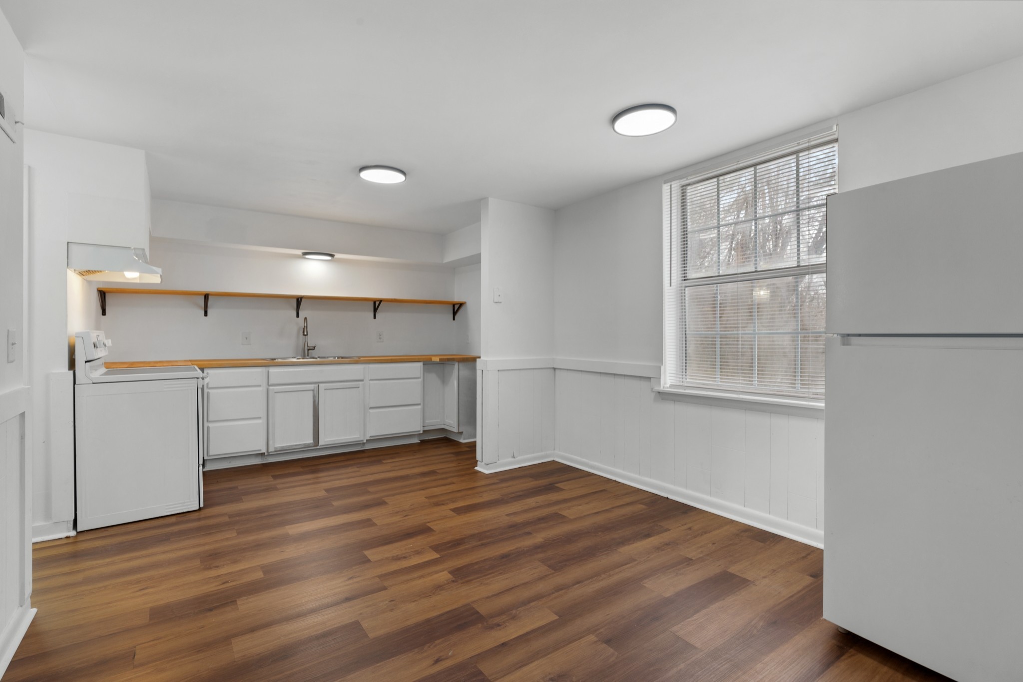 612 Andrea Court Antioch, TN 37013 - Photo 7 of 28 a view of a kitchen with wooden floor and windows