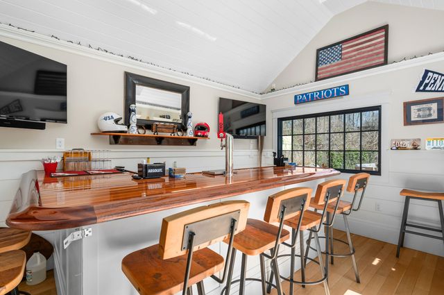 a living room with furniture window and a fireplace
