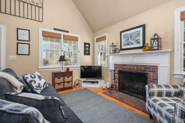 a bedroom with a table and chairs