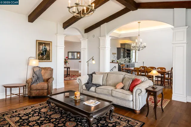 a bedroom with furniture and a chandelier