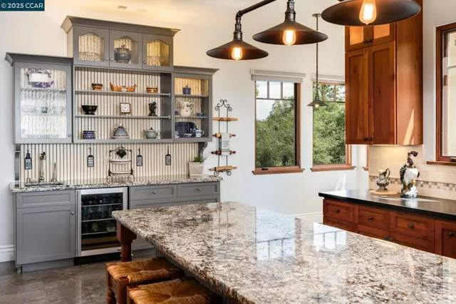 a view of a livingroom with wooden floor and a flat screen tv