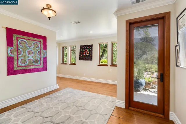 a kitchen with granite countertop a stove a sink and a wooden cabinets