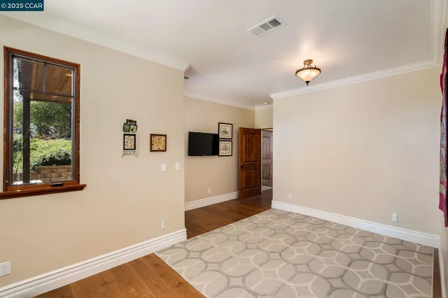 a view of a dining room with furniture and a chandelier