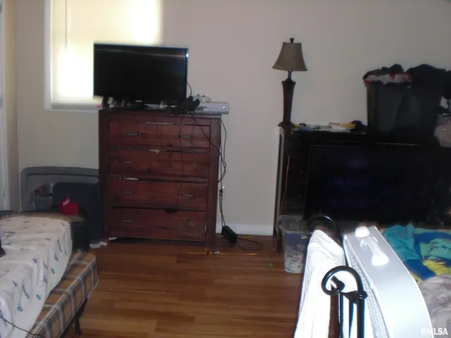 a living room with furniture and flat screen tv
