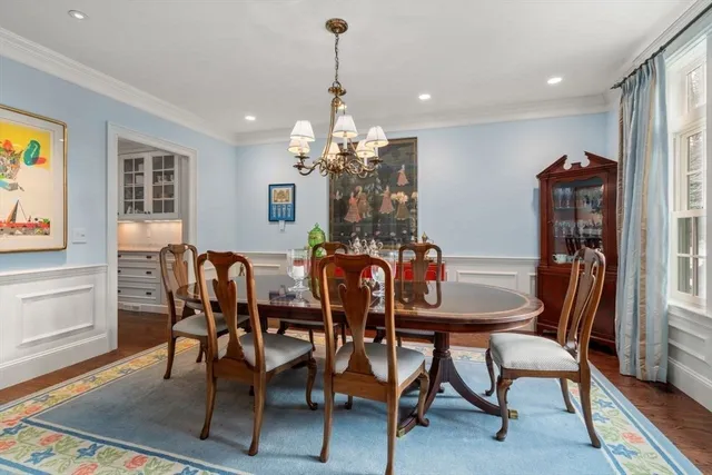 a view of a dining room with furniture and window