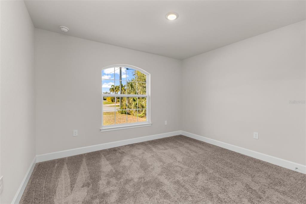 9500 Singer Circle Port Charlotte, FL 33981 - Photo 14 of 60 an empty room with a window