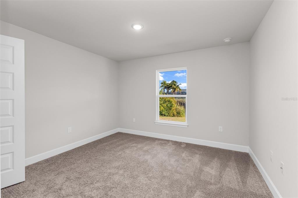 9500 Singer Circle Port Charlotte, FL 33981 - Photo 18 of 60 an empty room with a window