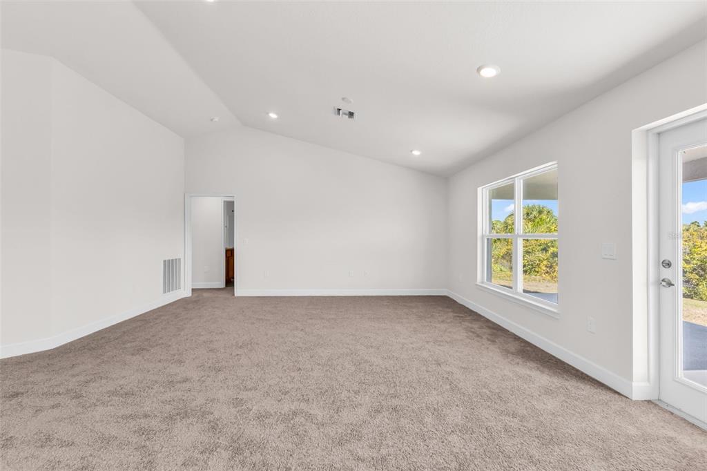 9500 Singer Circle Port Charlotte, FL 33981 - Photo 28 of 60 an empty room with windows